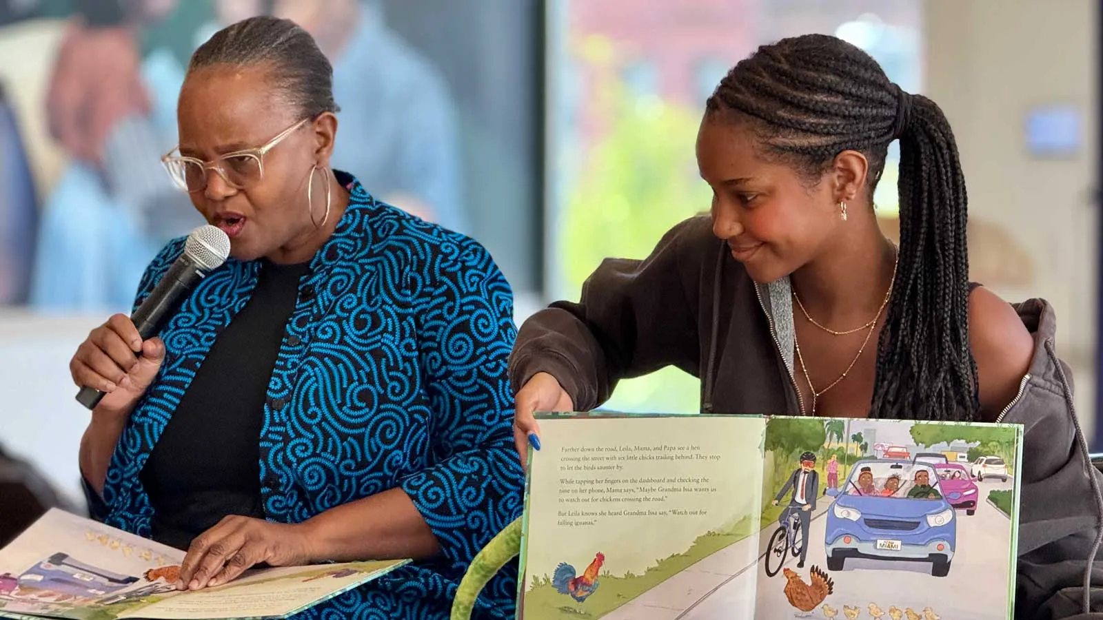 Professor Edwidge Danticat with her daughter Leila Danticat reading from Danticant’s book “Watch Out for Falling Iguanas.”