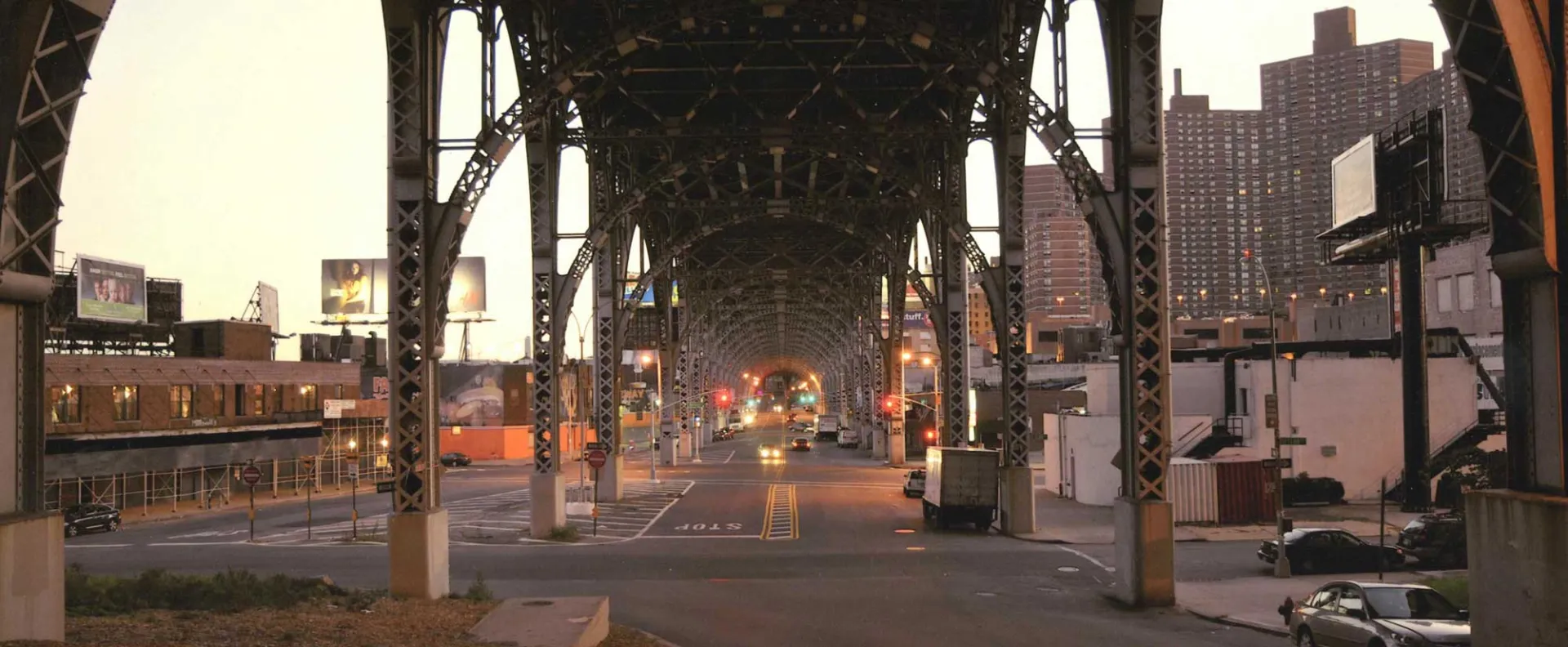 photo of Harlem street below elevated subway tracks