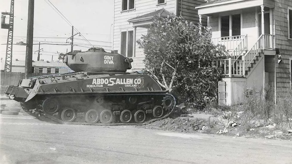 tank prepares to attack house