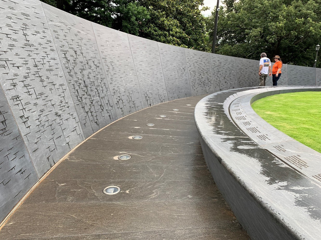 Photo credit:  Visitors at the Memorial to Enslaved Laborers at the UVA after the rain. Photo by Howeler & Yoon Architecture