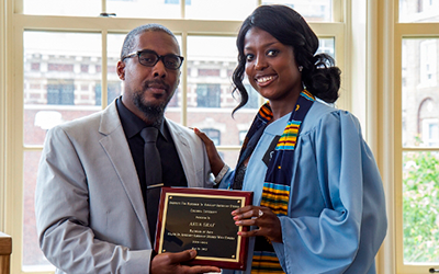 Graduate receiving a plaque